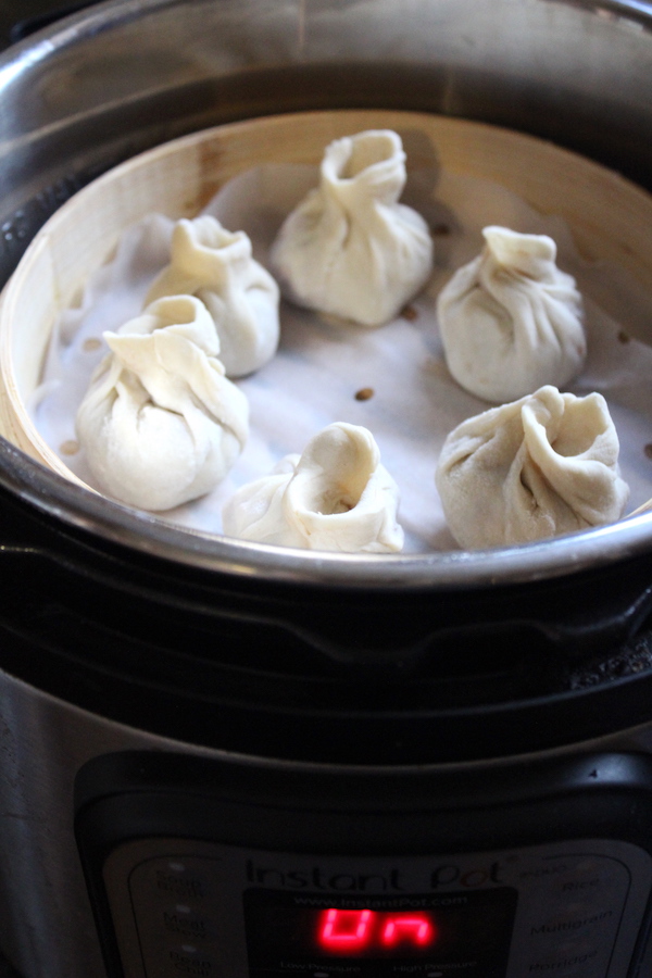 Cooking dumpling inside a steamer