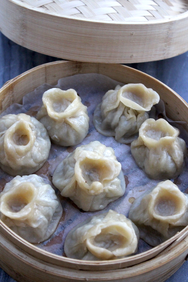 Cooking dumpling inside a steamer